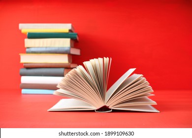 Open Book On Red Background