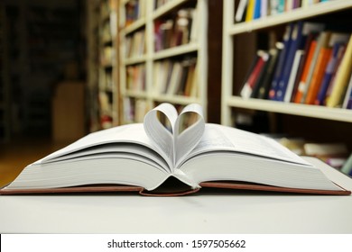 Open Book On Table In Library