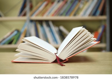 Open Book On The Table In Library