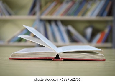 Open Book On The Table In Library