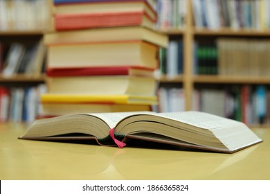 Open Book On The Table In Library