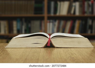 Open Book On Table In Library