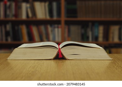 Open Book On Table In Library