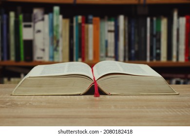 Open Book On Table In Library