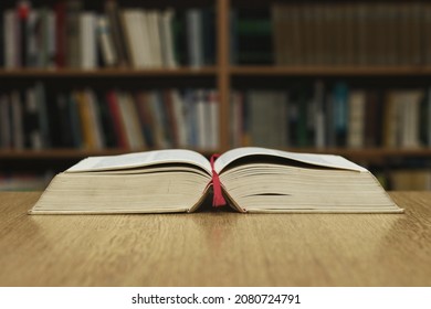 Open Book On Table In Library