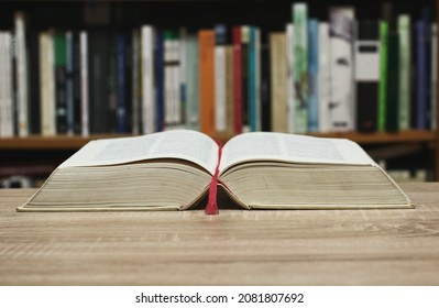 Open Book On Table In Library