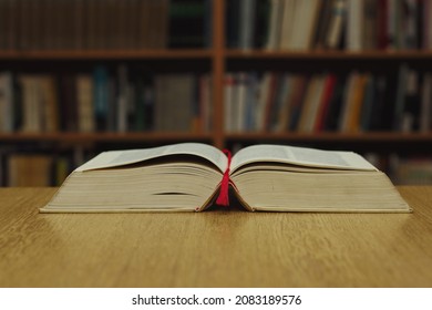 Open Book On Table In Library