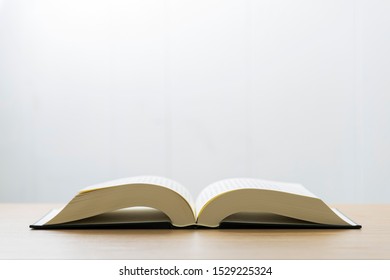 Open book on a white background.