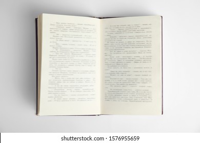 Open Book On White Background, Top View. Space For Text