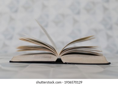 Open book on white background in library