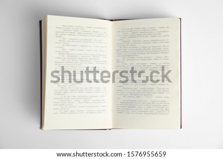 Open book on white background, top view. Space for text