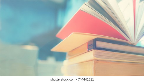 Open Book On Wood Desk In The Library Room With Blurred Focus For Background, Education Back To School Concept, Vintage Color Tone Process