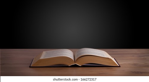 Open book on wooden deck and copy space - Shutterstock ID 166272317