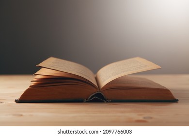 open book on a wooden table