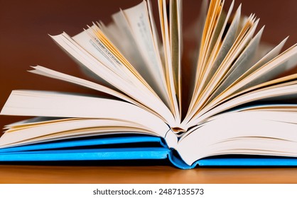 open book on wooden table, close-up of book with pages left open, school books on the shelf. idea of going back to school - Powered by Shutterstock