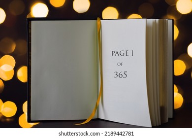 Open book with Page one of 365, new year concept