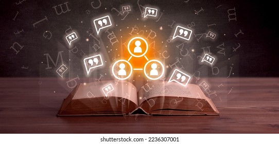 Open book with social networking icons above - Shutterstock ID 2236307001