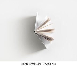 Open Book With Soft Shadow On White Paper Background.