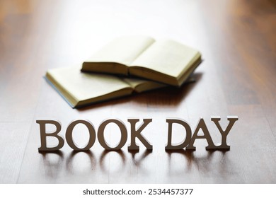 Open Books with Book Day Sign on Wooden Floor Representing Reading and Literacy Celebration - Powered by Shutterstock