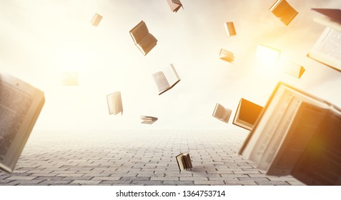 Open Books Flying Around On Light Sky Background