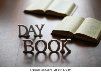 Open Books on Wooden Floor with DAY and BOOK Letters for Reading and Literature Concept - Powered by Shutterstock