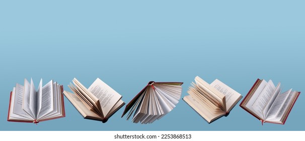 open books and textbooks fly on a blue background, copy space