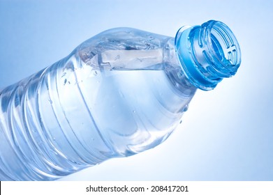 Open A Bottle Of Water On Blue Background