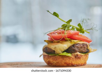 Open Burger With Beef Patty, Red Tomato And Cream Cheese Close-up