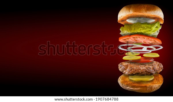 Open burger floating with bread pickle lettuce\
tomato onion mustard mayonnaise and ketchup red and black\
background in 16:9 format