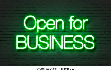 Open For Business Neon Sign On Brick Wall Background