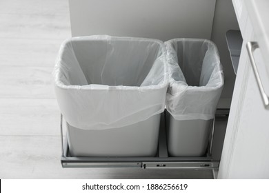 https://image.shutterstock.com/image-photo/open-cabinet-empty-trash-bins-260nw-1886256619.jpg