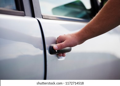 Open The Car Door. The Man Opens The Car. Pull The Door To You