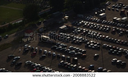 Open car parking top view. Parking with cars from a bird's eye view
