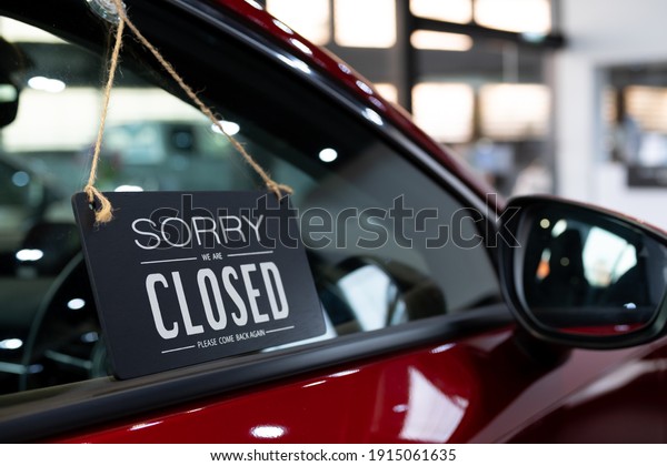 open car with red car in dealership for door car\
 ideas unlock freedom tourist travel for lifestyle customer from\
salesman sign welcome new normal during Coronavirus disease\
covid-19 unlock lockdown