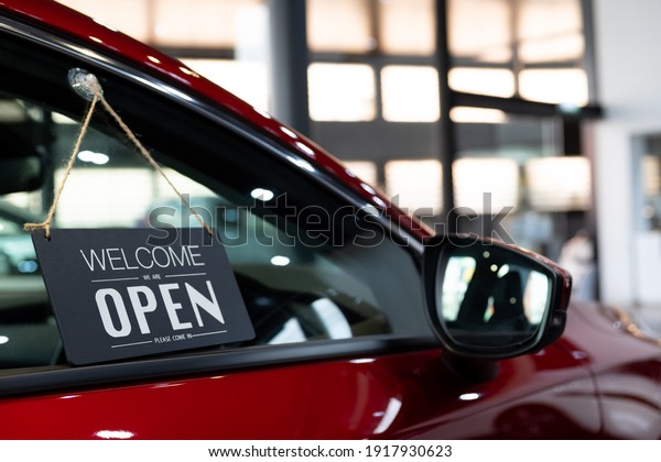 open car  with red car in dealership for door\
car  ideas unlock freedom tourist travel for lifestyle customer\
from salesman sign welcomenew normol during Coronavirus disease\
covid-19 unlock lockdown