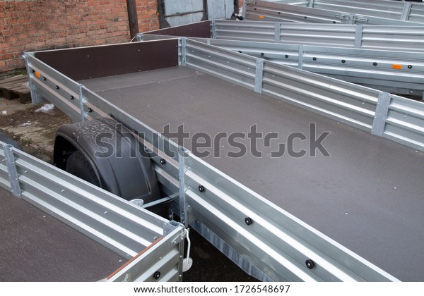 Open car trailer. Trailer for
passenger cars.Sale, rental and maintenance of
trailers.