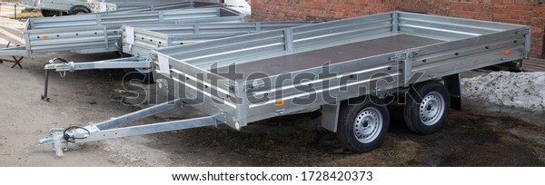 Open car trailer. Trailer for\
passenger cars.Sale, rental and maintenance of\
trailers.