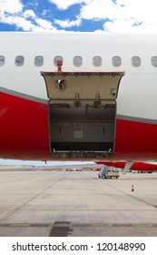 Open Cargo Door On An Airplane / Empty Cargo Compartment