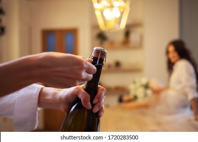 Open The Champagne. A Woman's Hand In The Foreground, Uncorking A Bottle Of Prosecco
