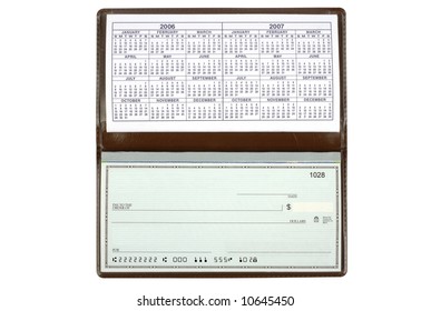 An Open Checkbook Showing The Calendar.