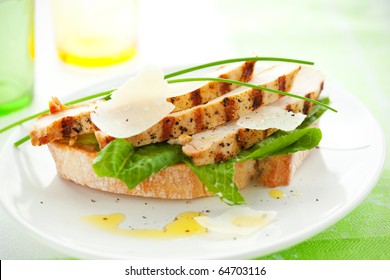 Open Chicken Caesar Sandwich On The White Plate