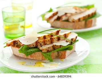 Open Chicken Caesar Sandwich On The White Plate