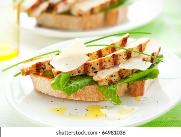 Open Chicken Caesar Sandwich On The White Plate