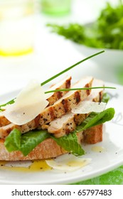 Open Chicken Caesar Sandwich On The White Plate