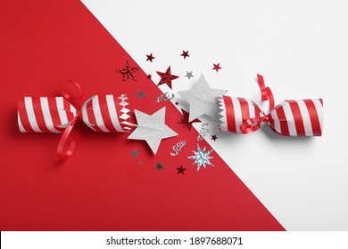 Open Christmas Cracker With Shiny Confetti On Color Background, Top View