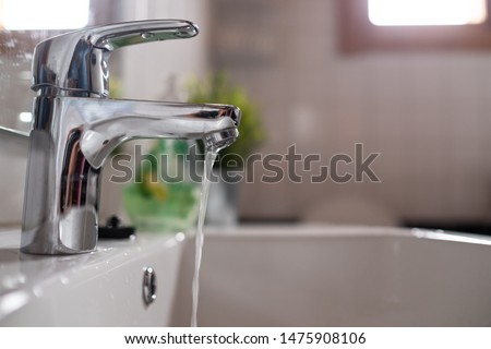 Open chrome faucet washbasin with low water pressure