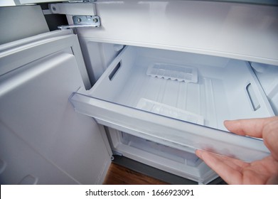 Open Clean Fridge Freezer Container With Ice Cubes 