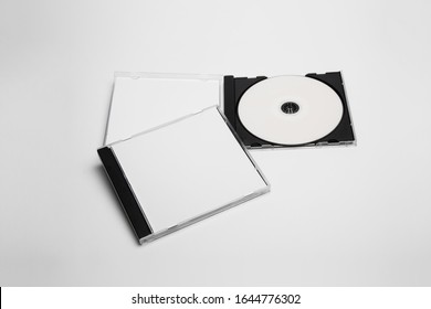 Open And Close Compact Plastic Disc Box Case Set With White Isolated Blank For Branding Design. CD Jewel Mock-up On Soft Gray Background. DVD Or CD Disc