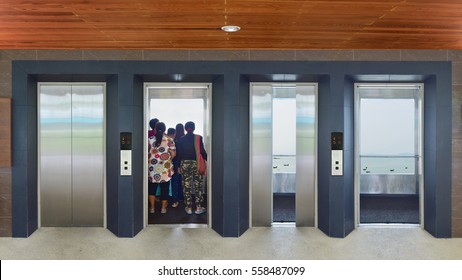 Open And Closed Chrome Metal Office Building Elevator Doors Realistic Photo. Lift Transportation Floor To Floors With Push Switch For Up And Down.
