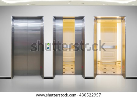 Open and closed chrome metal office building elevator doors realistic photo. Lift transportation floor to floors with push switch for up and down.